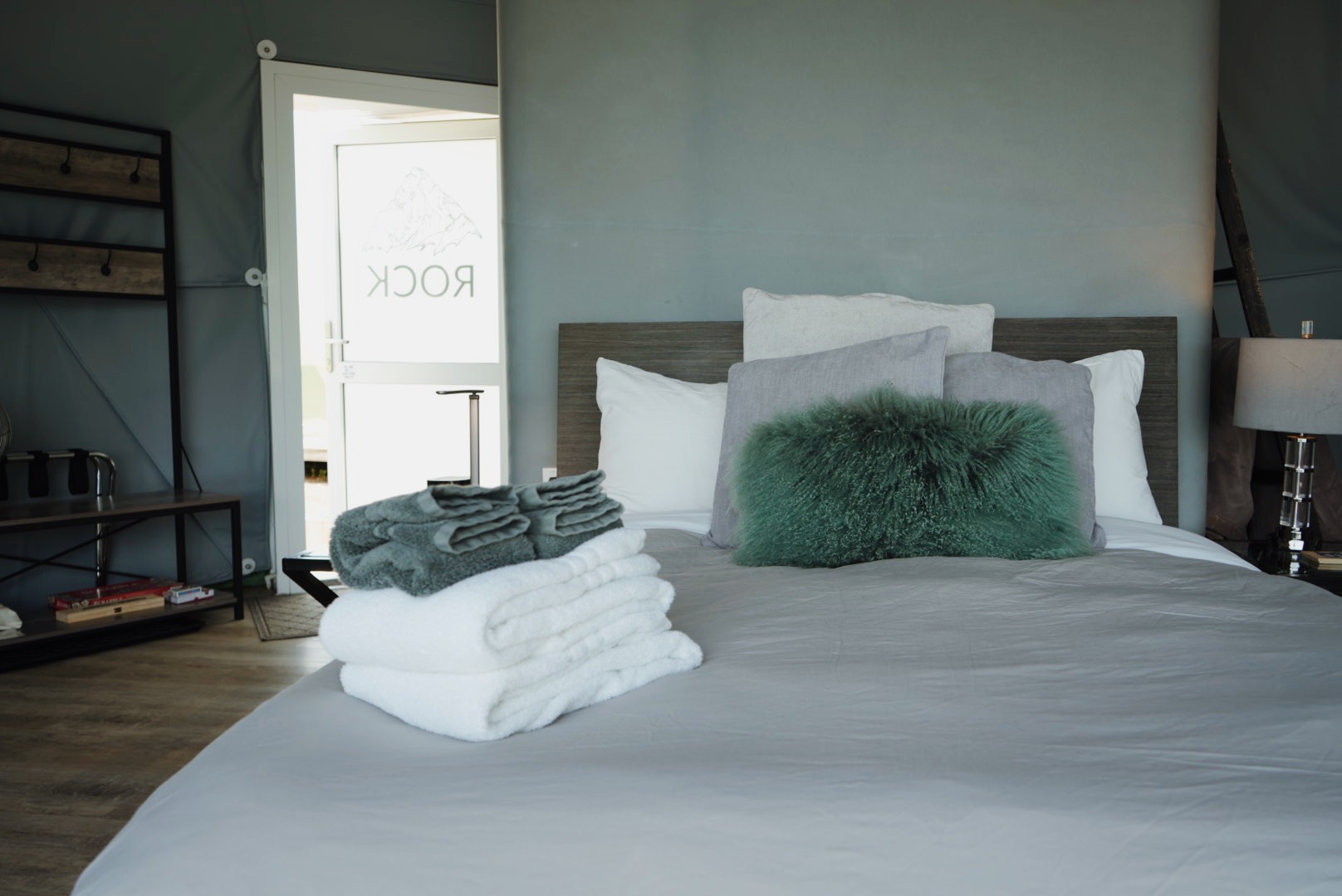 Rock Pod interior with bed and cozy pillows